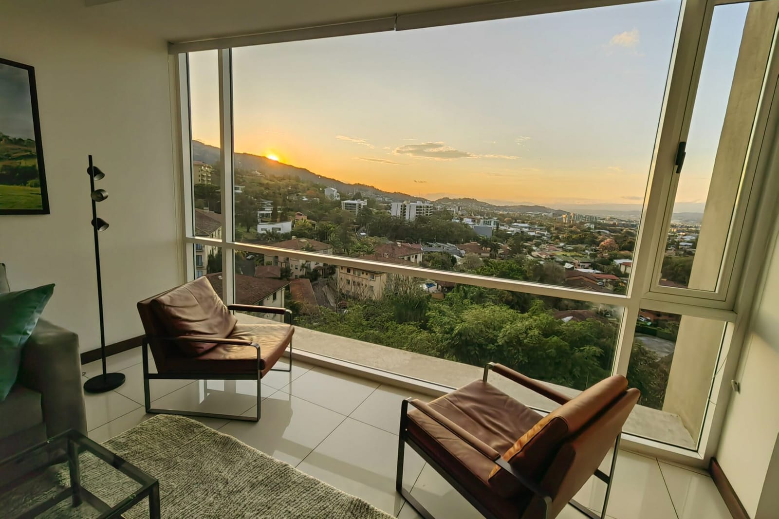 Sunset over Escazú seen from the leather armchairs