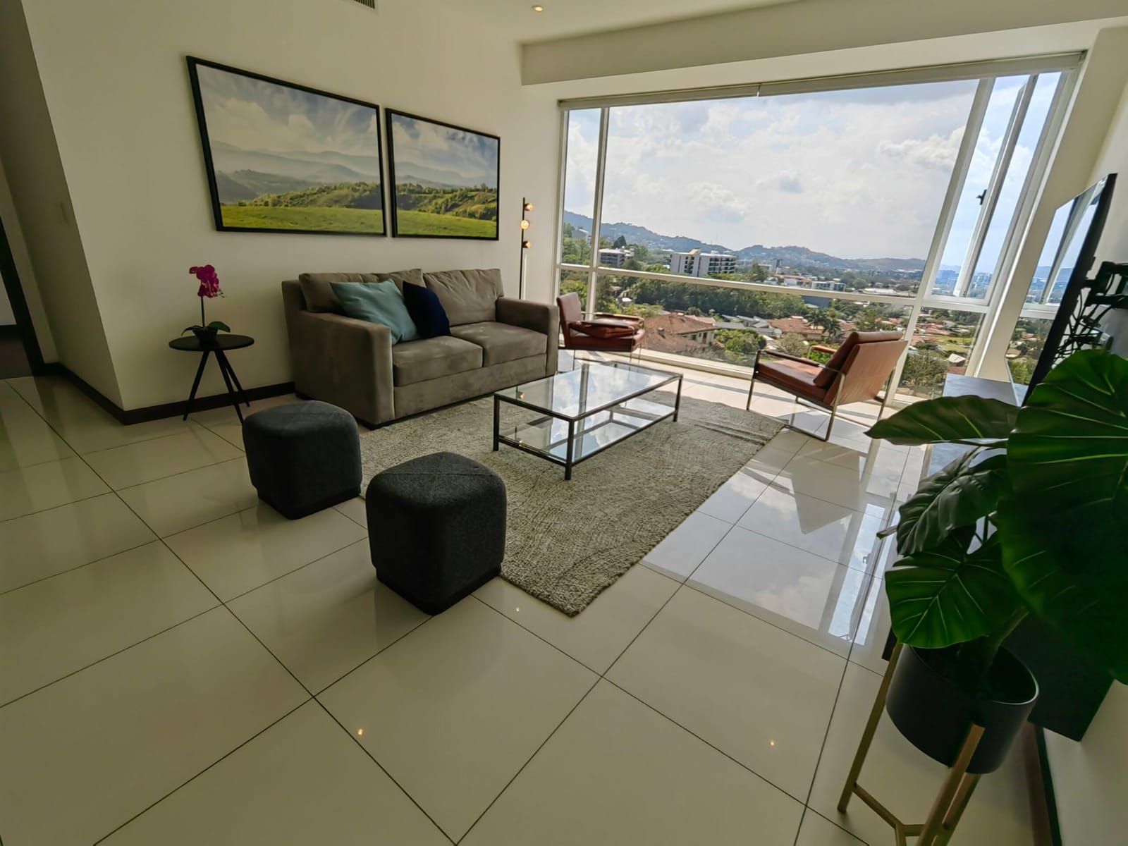 Sectional sofa and glass table with the mountains outside