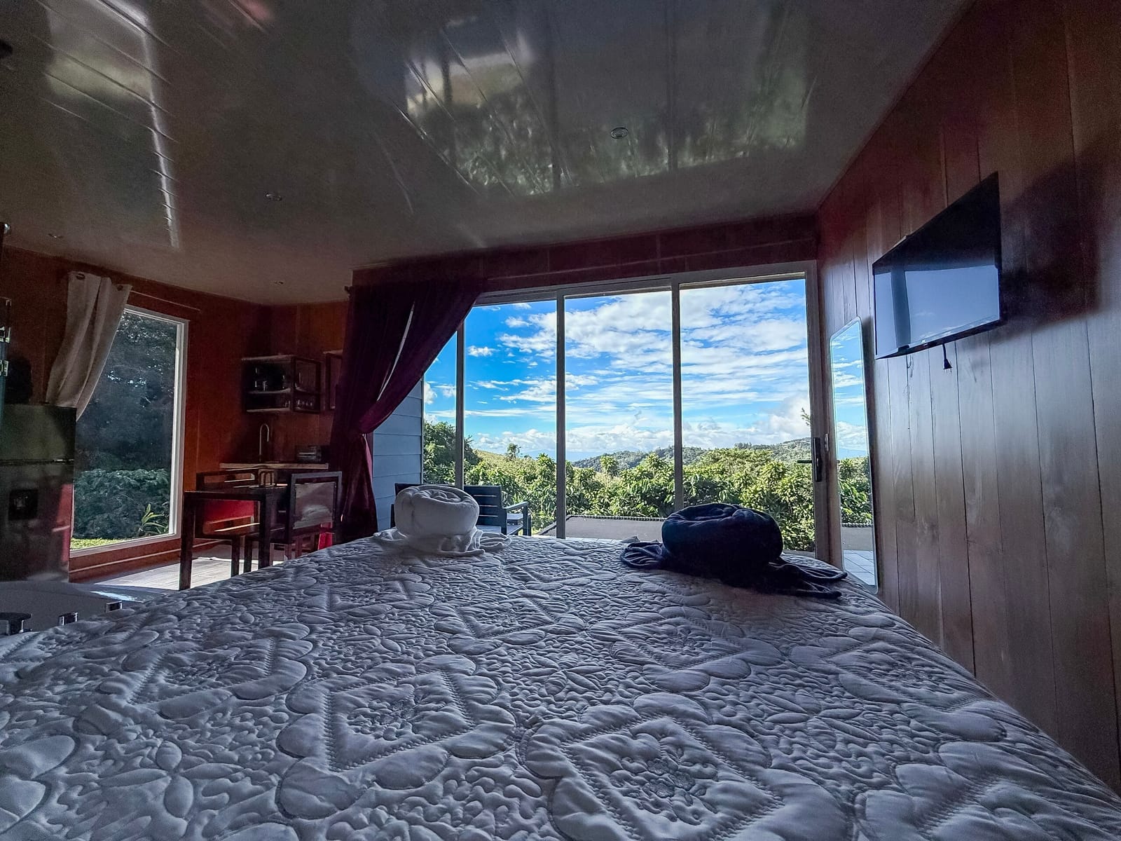 View from the bed through the open front to the hills