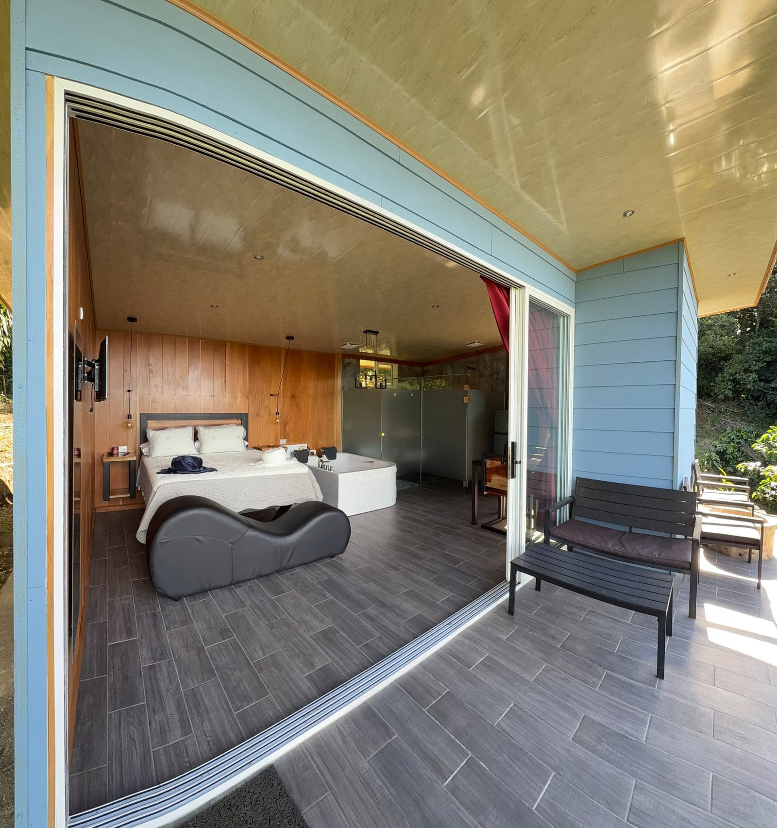 Deck bench outside the open glass doors to the bedroom