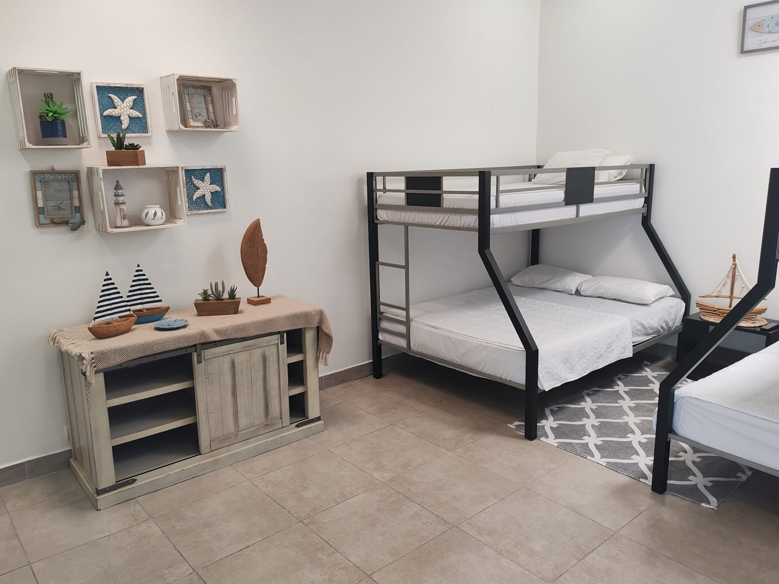 Second bedroom with bunk bed and coastal decor
