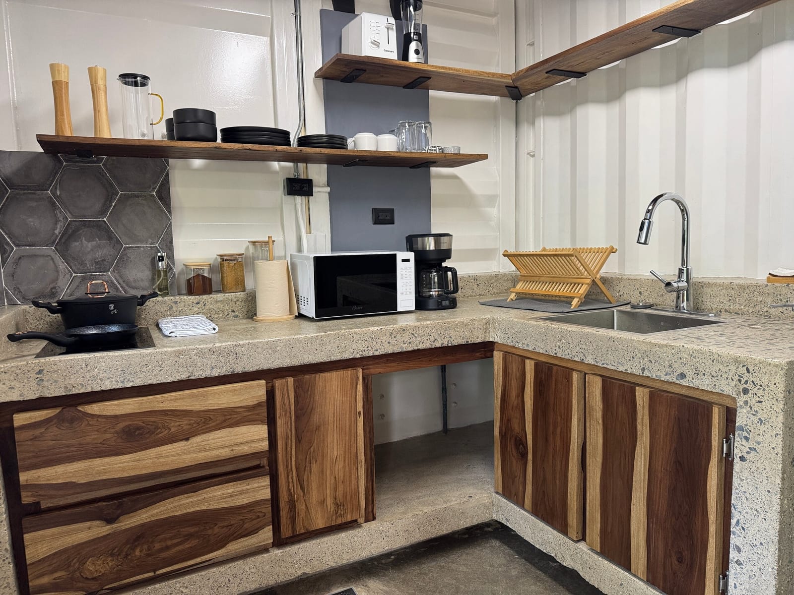 Kitchenette with microwave, coffee maker and wood drawers