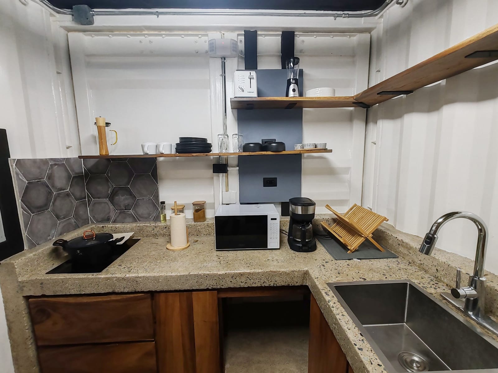 Hexagon tile backsplash behind the cooktop and sink