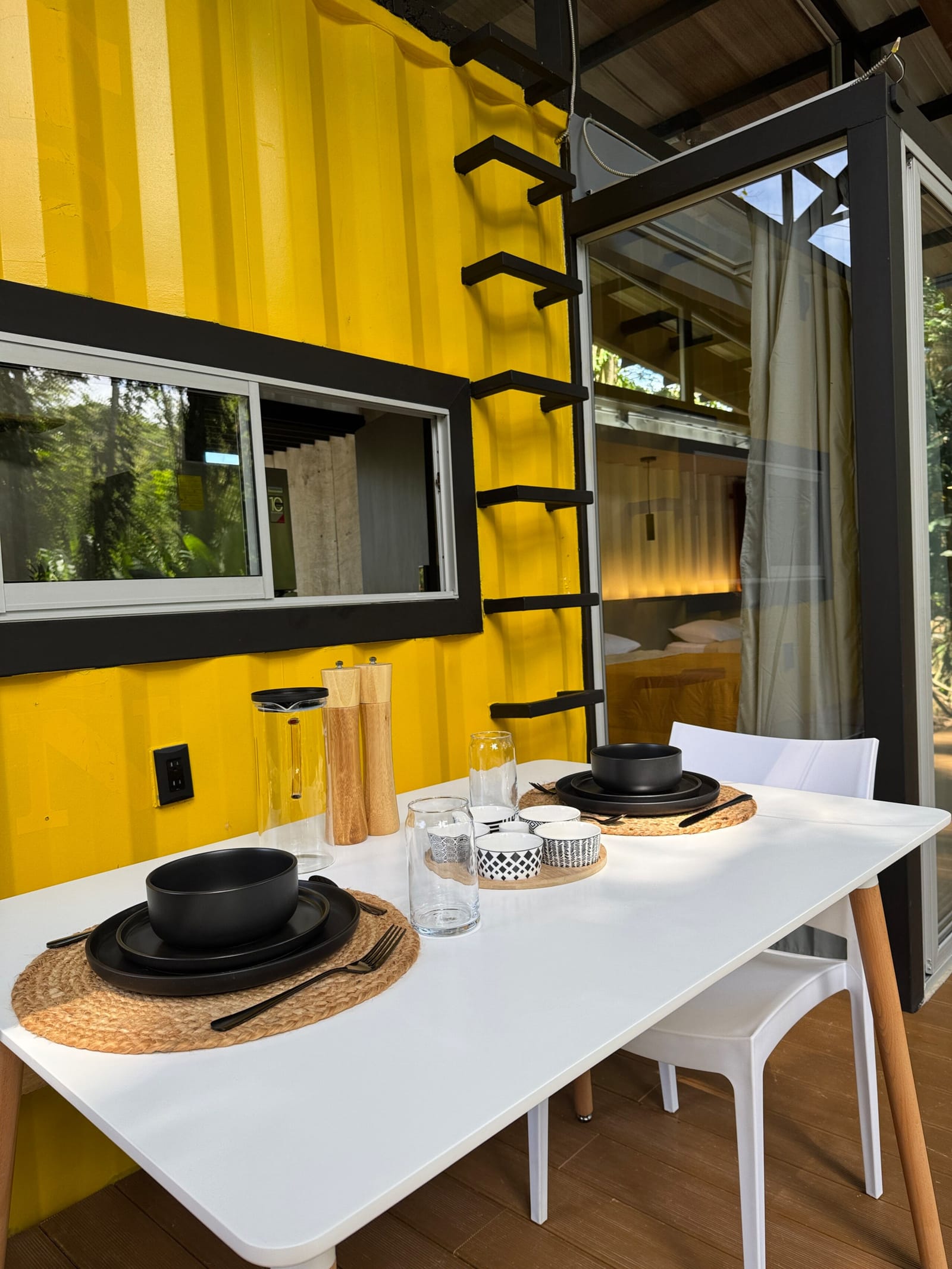 Place settings on the deck table under the overhang