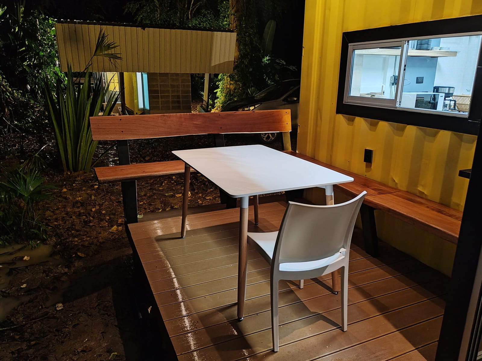 Deck with bench and table between the two containers