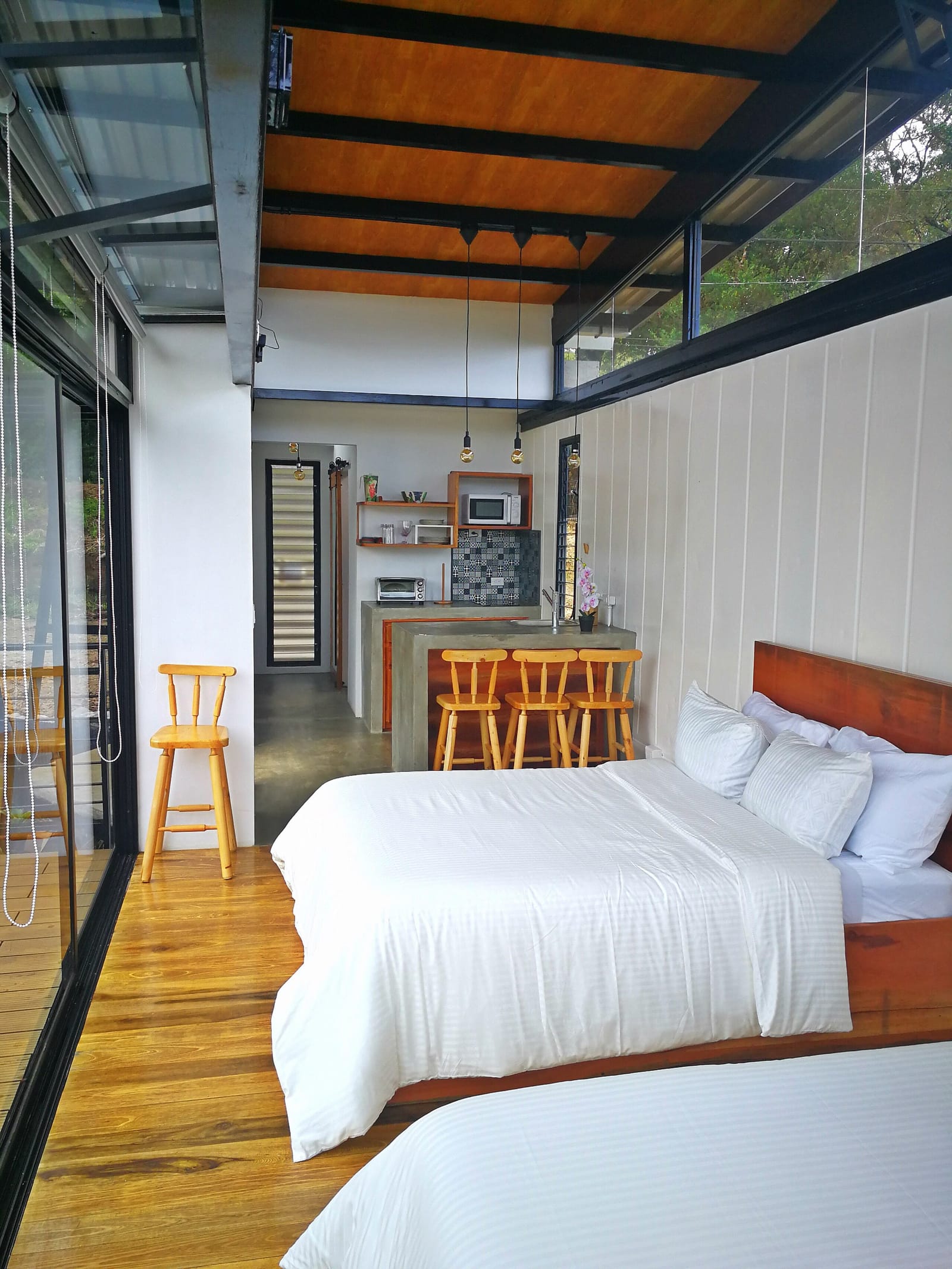 Open loft with kitchen island and beds in one room