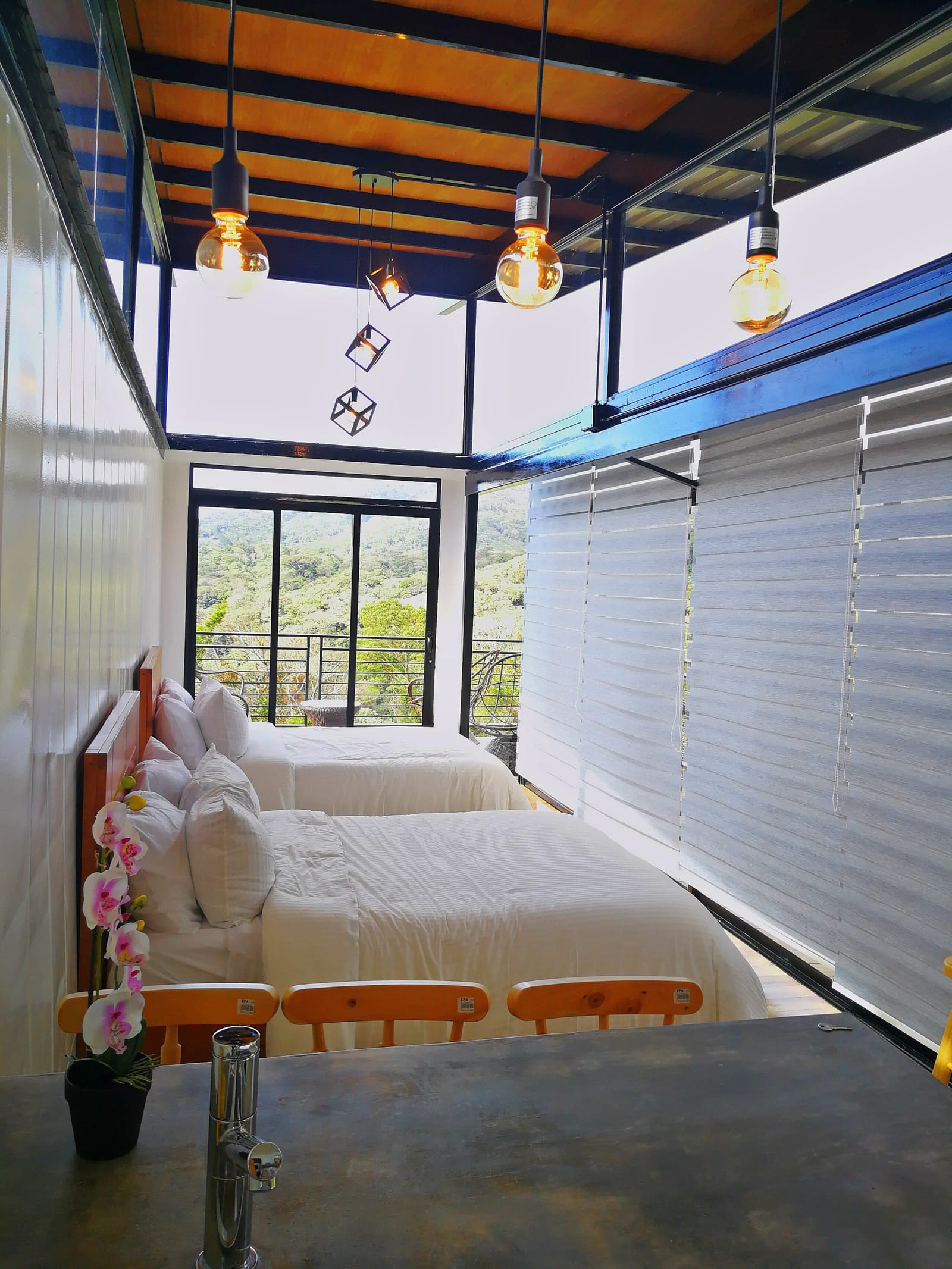 Loft interior with the roller shades down at night