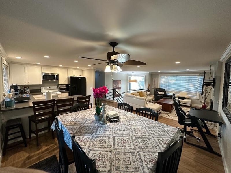 Dining table with patterned cloth beside the kitchen