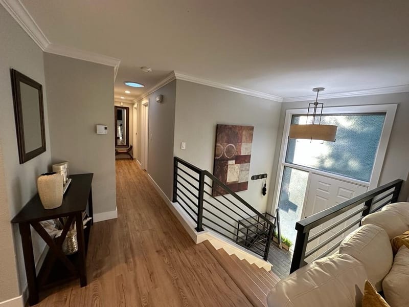 Entry hall with console table and stair railing