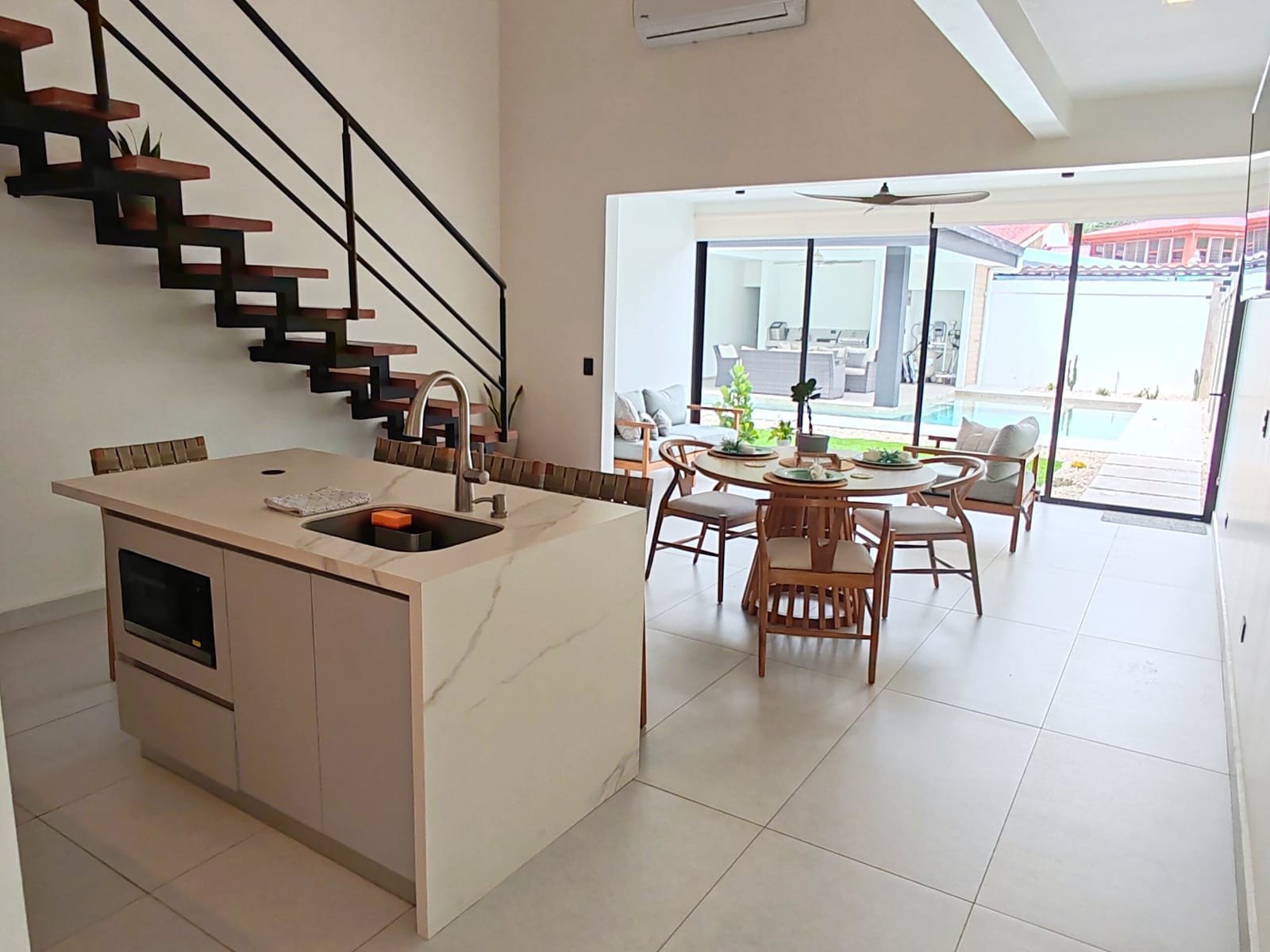 Kitchen island and dining area under the stair
