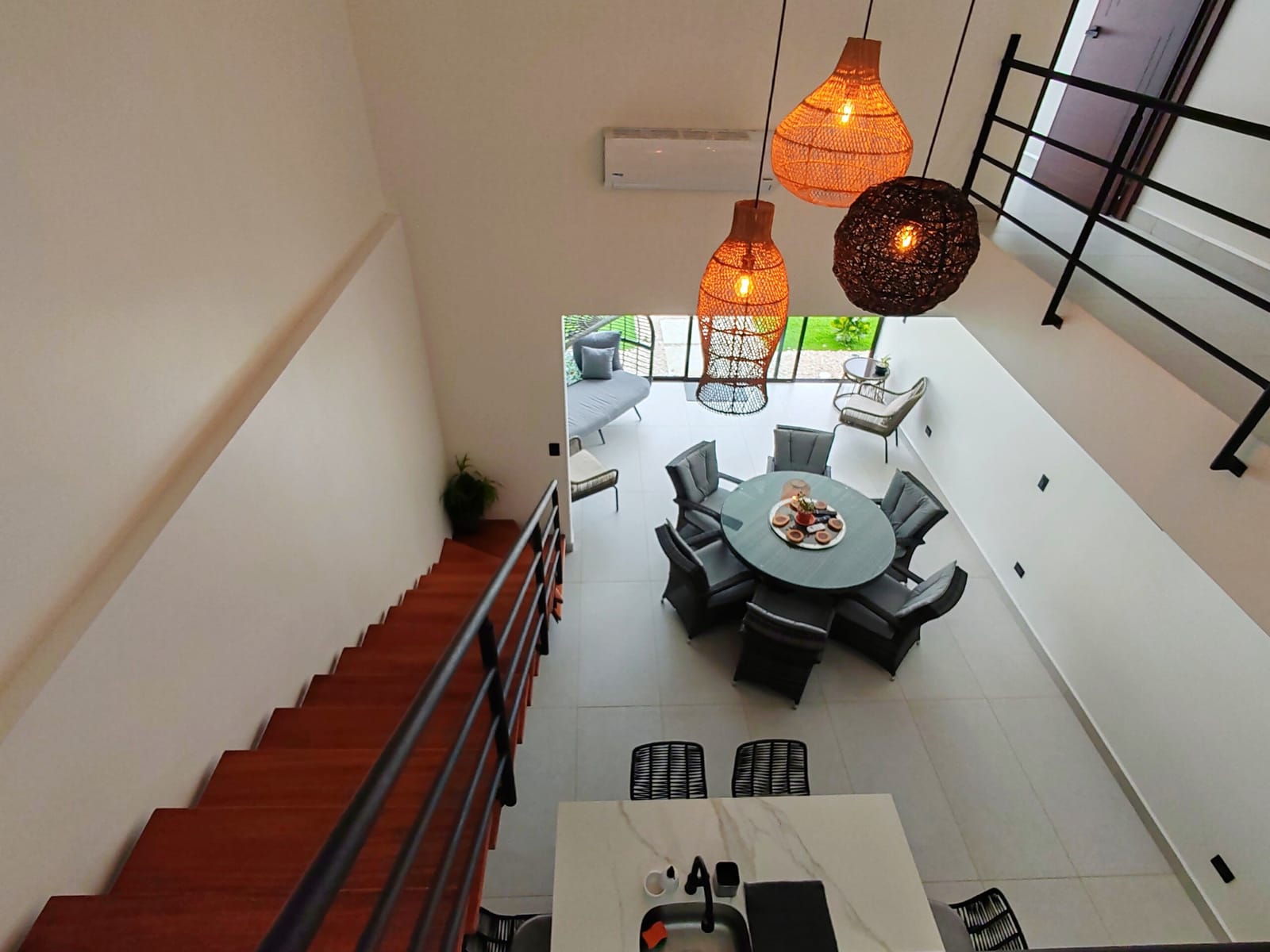 Rattan pendant lamps over the dining table seen from above